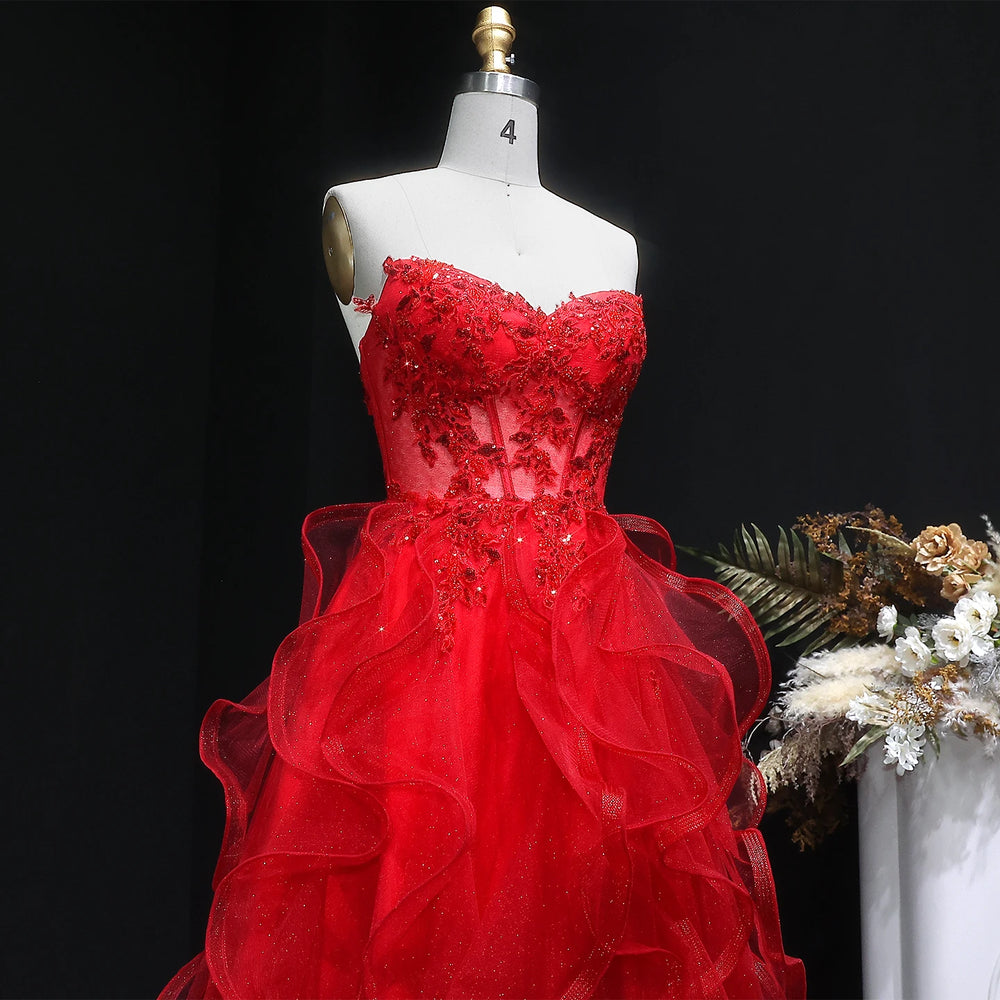 Red evening gown on a mannequin with a dark background