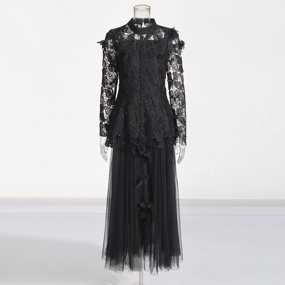 Black lace top and tulle skirt on a mannequin against a white background