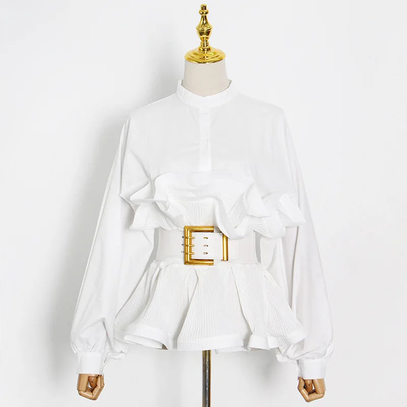 White blouse with a gold belt on a mannequin against a white background