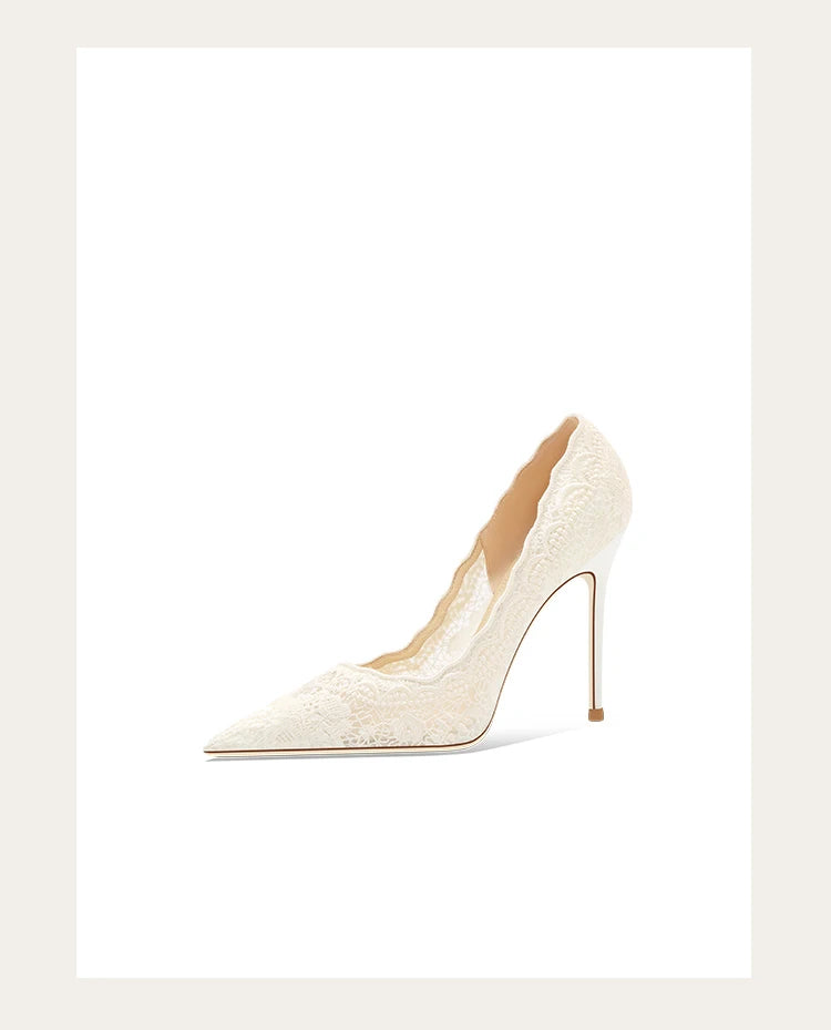 White high-heeled shoe on a light beige background