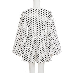 Polka dot dress on a mannequin against a white background