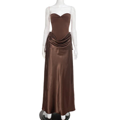 Brown evening gown on a mannequin against a white background