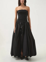 Black strapless gown on a white background