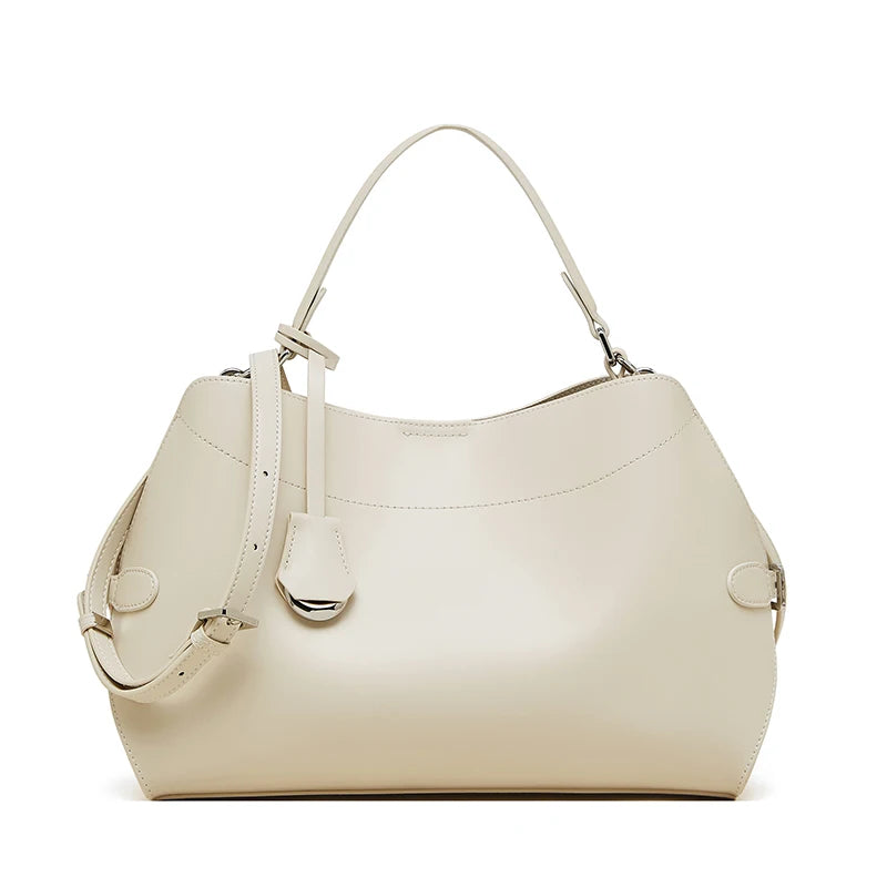Beige handbag with a strap on a white background