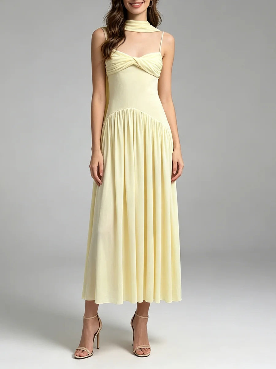 Full length view of a pale yellow ruched twist front midi dress