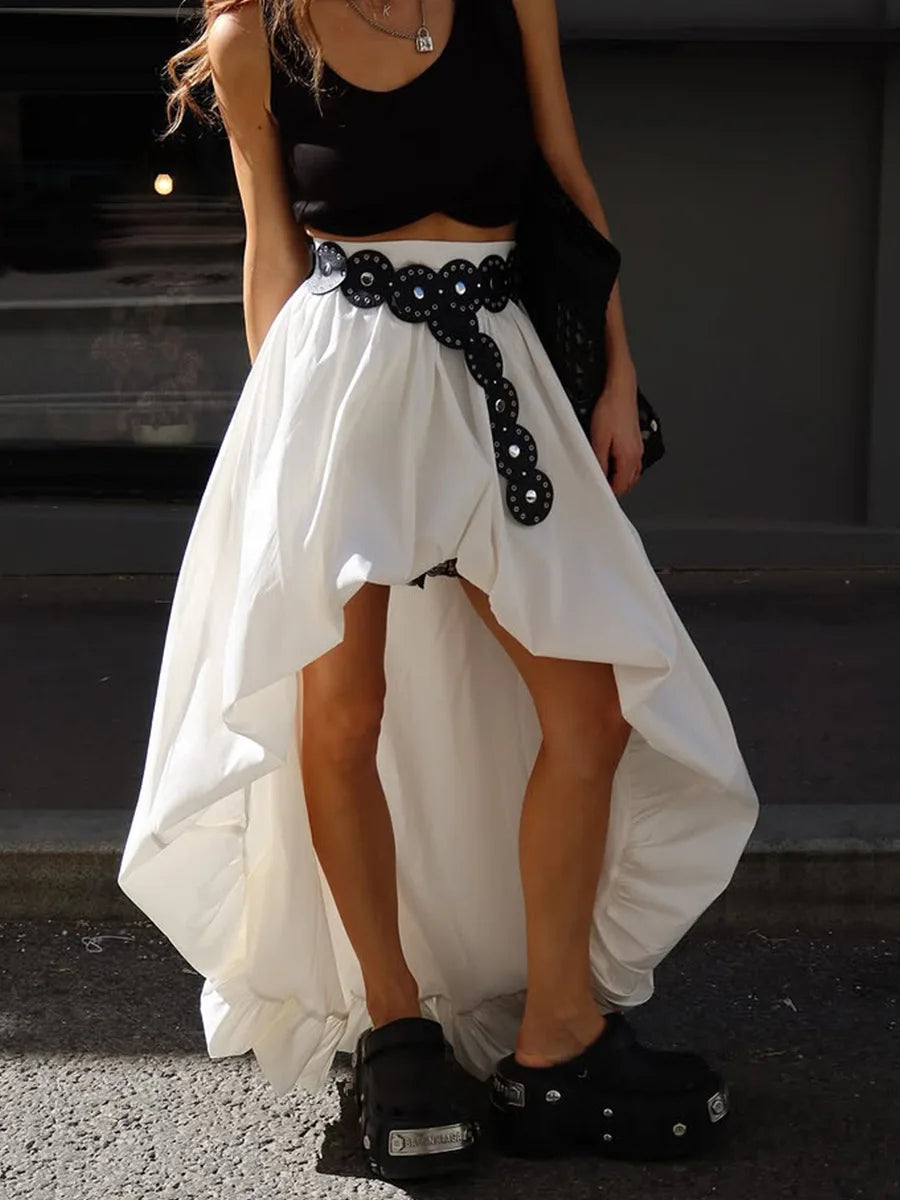 Close-up of the voluminous hem detail on the asymmetric midi skirt