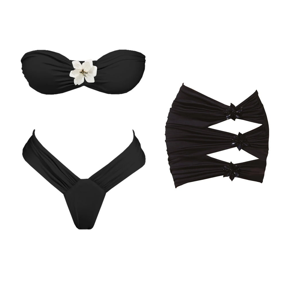 Black floral bikini top and skirt set laid flat.