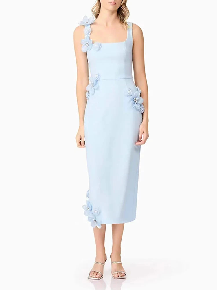 Light blue dress with floral embellishments on a white background