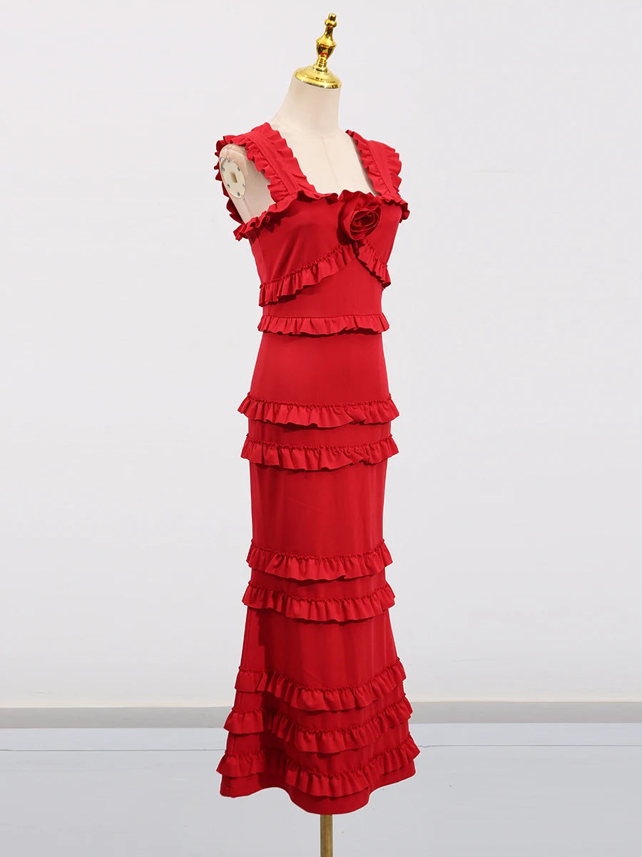 Red ruffled dress on a mannequin against a white background