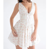 White floral dress with a plunging neckline on a white background