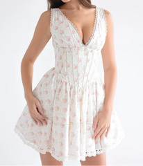 White floral dress with a plunging neckline on a white background