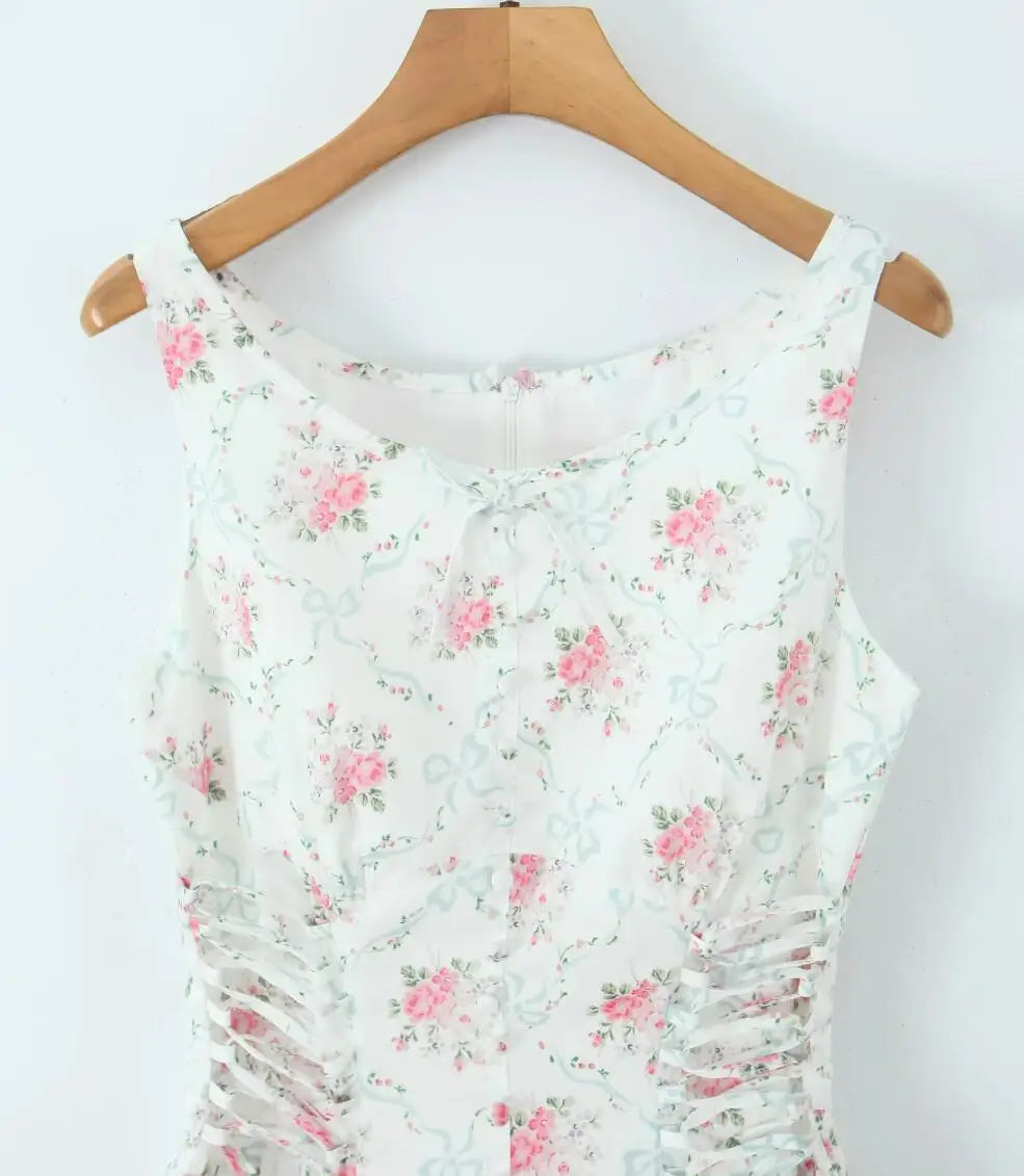 Floral dress on a wooden hanger against a white background