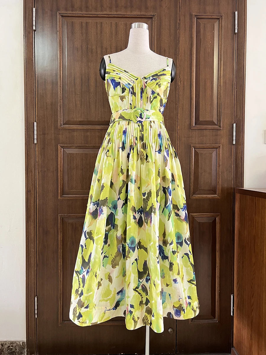 Yellow floral dress on a mannequin against a wooden door.