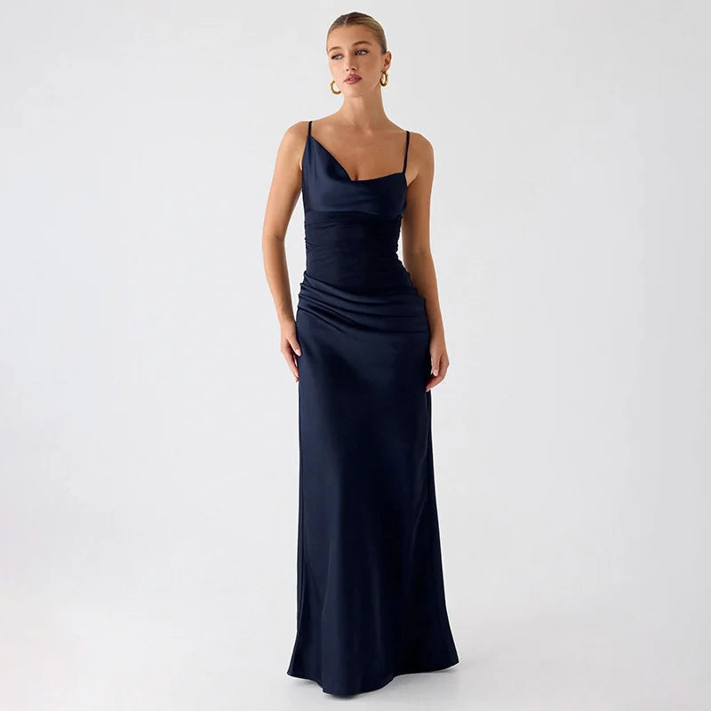 Woman wearing a navy blue evening gown on a white background