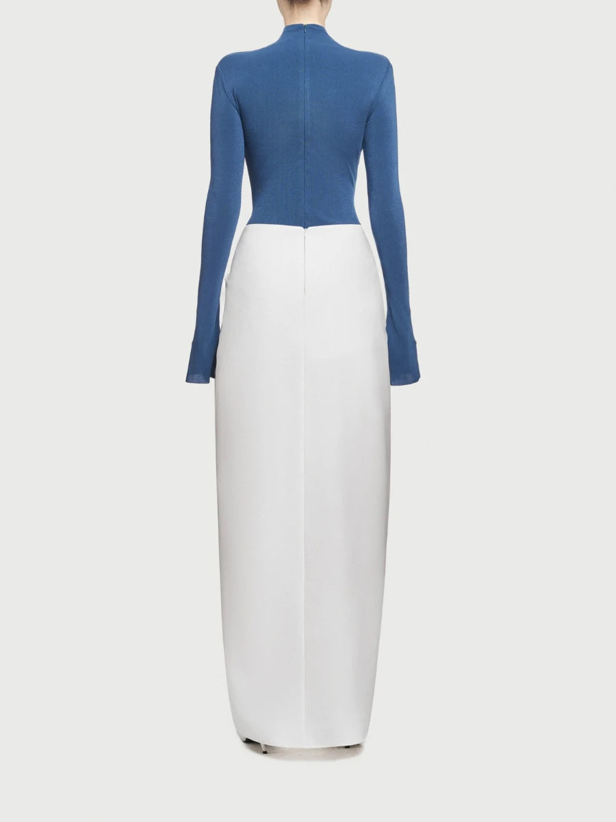 Blue top and white skirt set on a light gray background