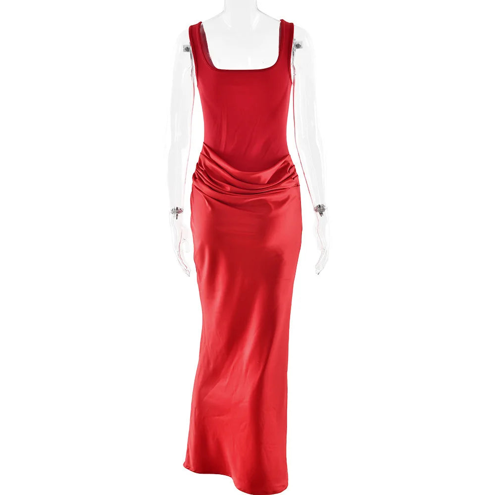 Red evening gown on a mannequin against a white background