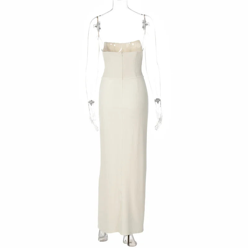 White strapless evening gown with pearl embellishments on a mannequin against a white background