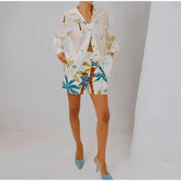 Person wearing a colorful outfit with a white background