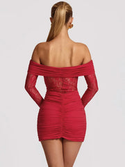Red off-shoulder dress worn by a model on a light gray background