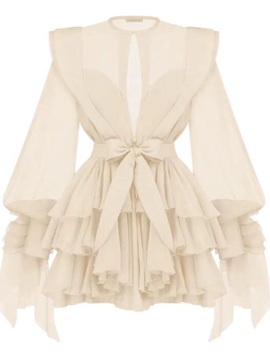 Beige ruffled dress with a tie detail on a white background