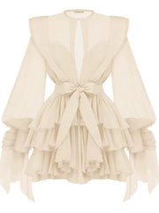 Beige ruffled dress with a tie detail on a white background