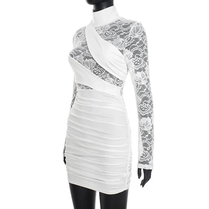 White dress with lace detailing on a mannequin against a white background