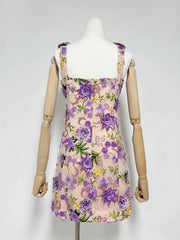 Floral dress on a mannequin against a white background