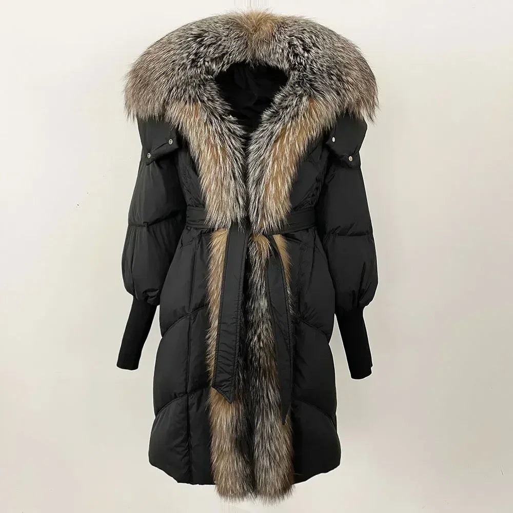 Black winter coat with fur trim on a white background