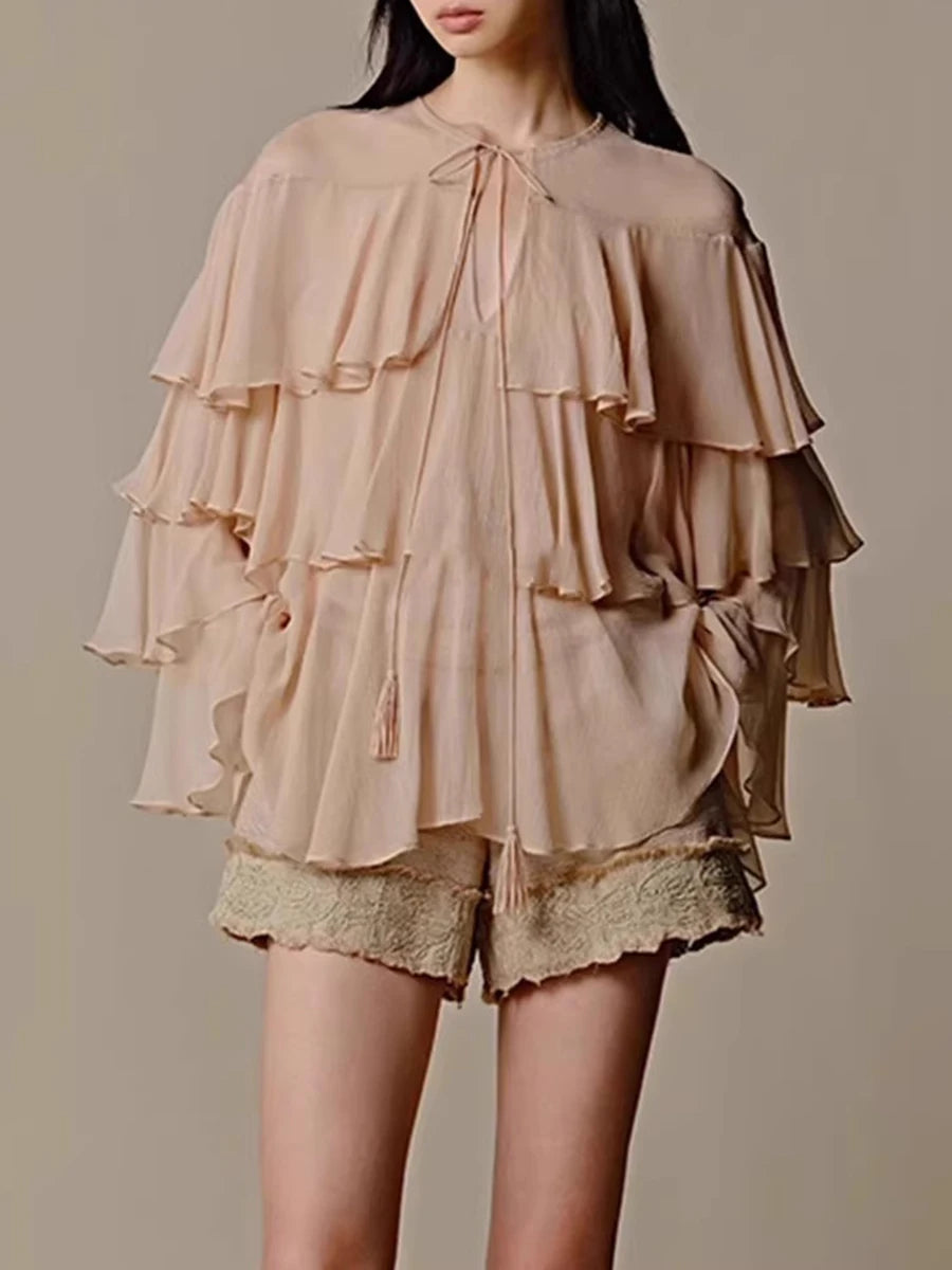 Layered ruffle blouse styled in a relaxed feminine shape