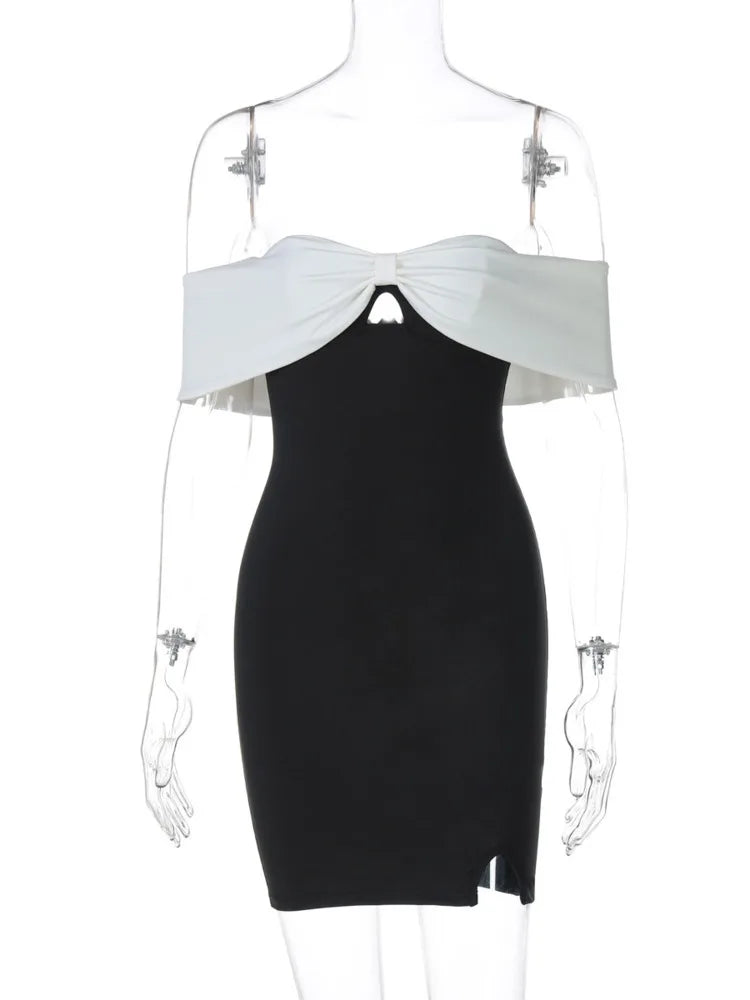 Black dress with white top on a mannequin against a white background