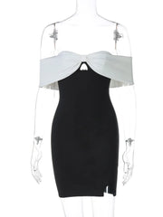 Black dress with white top on a mannequin against a white background