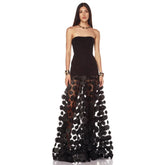 Strapless black maxi dress with dimensional floral appliques on skirt