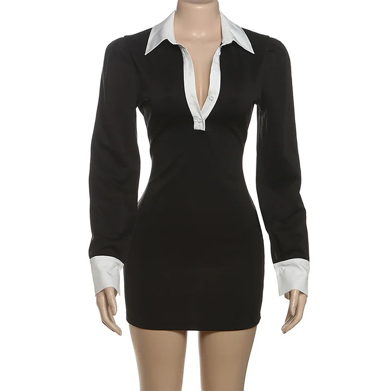 Black dress with white collar and cuffs on a mannequin against a white background
