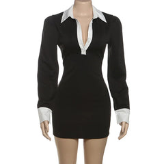 Black dress with white collar and cuffs on a mannequin against a white background