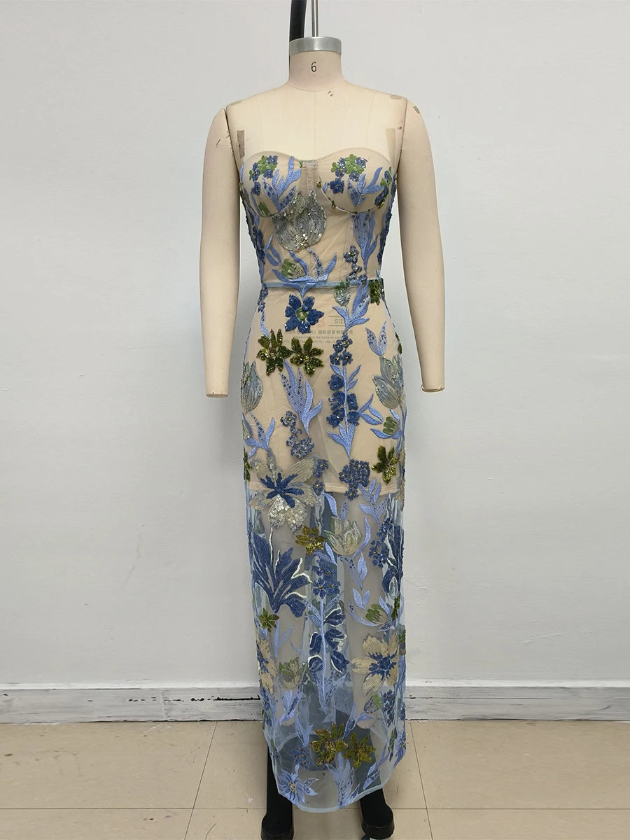 Floral strapless dress on a mannequin against a white background