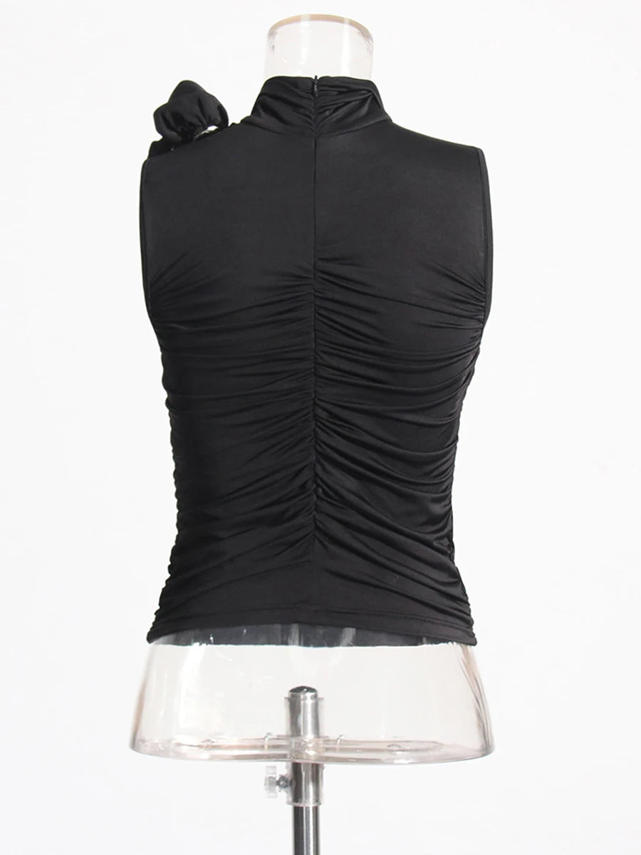 Black sleeveless top on a mannequin against a white background