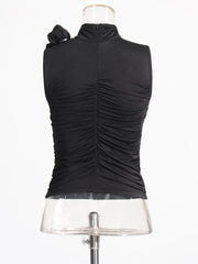 Black sleeveless top on a mannequin against a white background