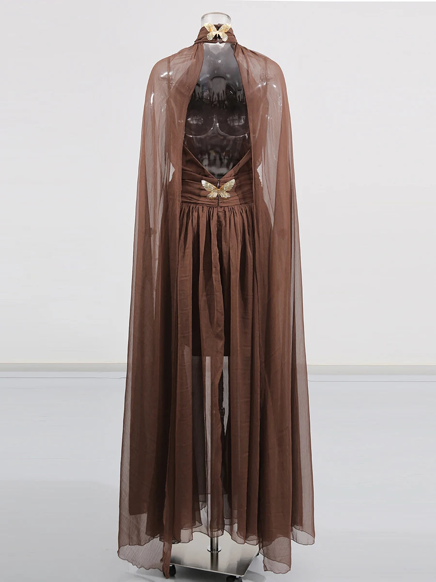 Brown dress with sheer overlay on a white background