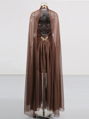 Brown dress with sheer overlay on a white background