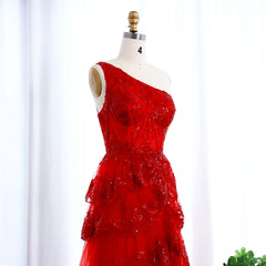 Red one-shoulder dress on a mannequin against a white background