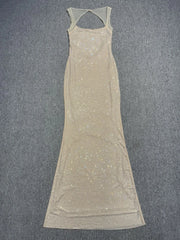 Beige sleeveless dress with thin straps on a gray background