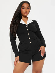 Woman wearing a black outfit with white collar and buttons