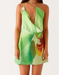 Green dress with a colorful design on a white background