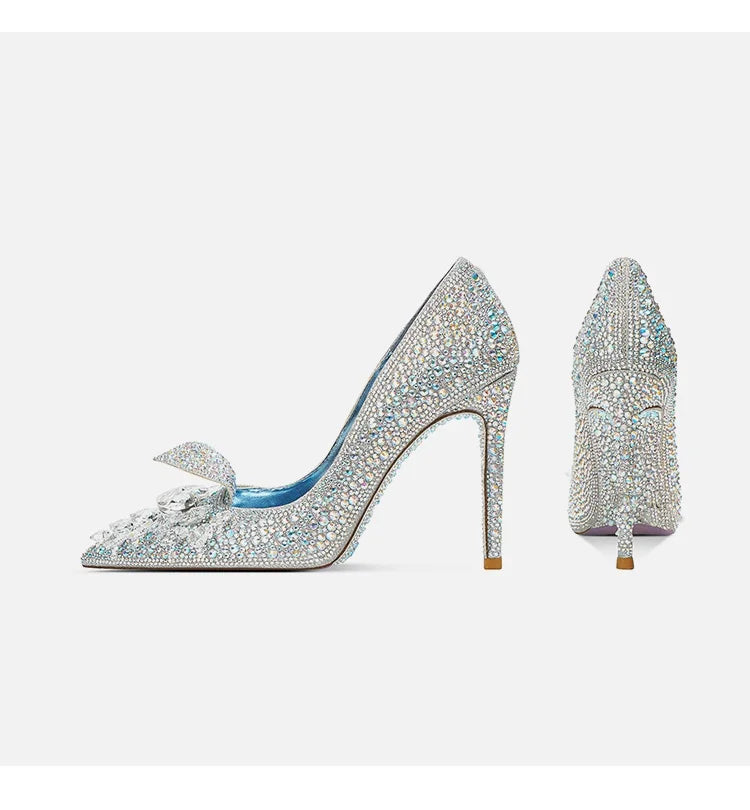 Pair of sparkling high-heeled shoes on a white background