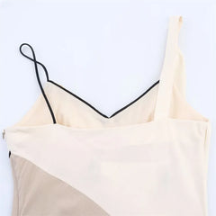 Beige spaghetti strap top on a light gray background
