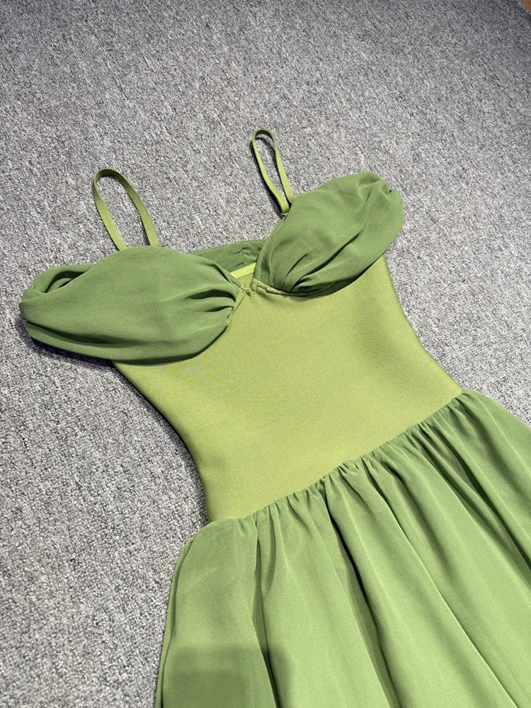 Green dress on a textured gray surface