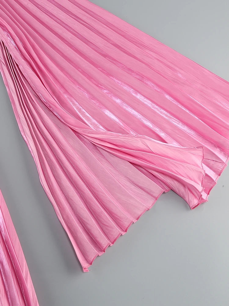 Pink pleated fabric on a gray background