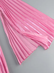 Pink pleated fabric on a gray background