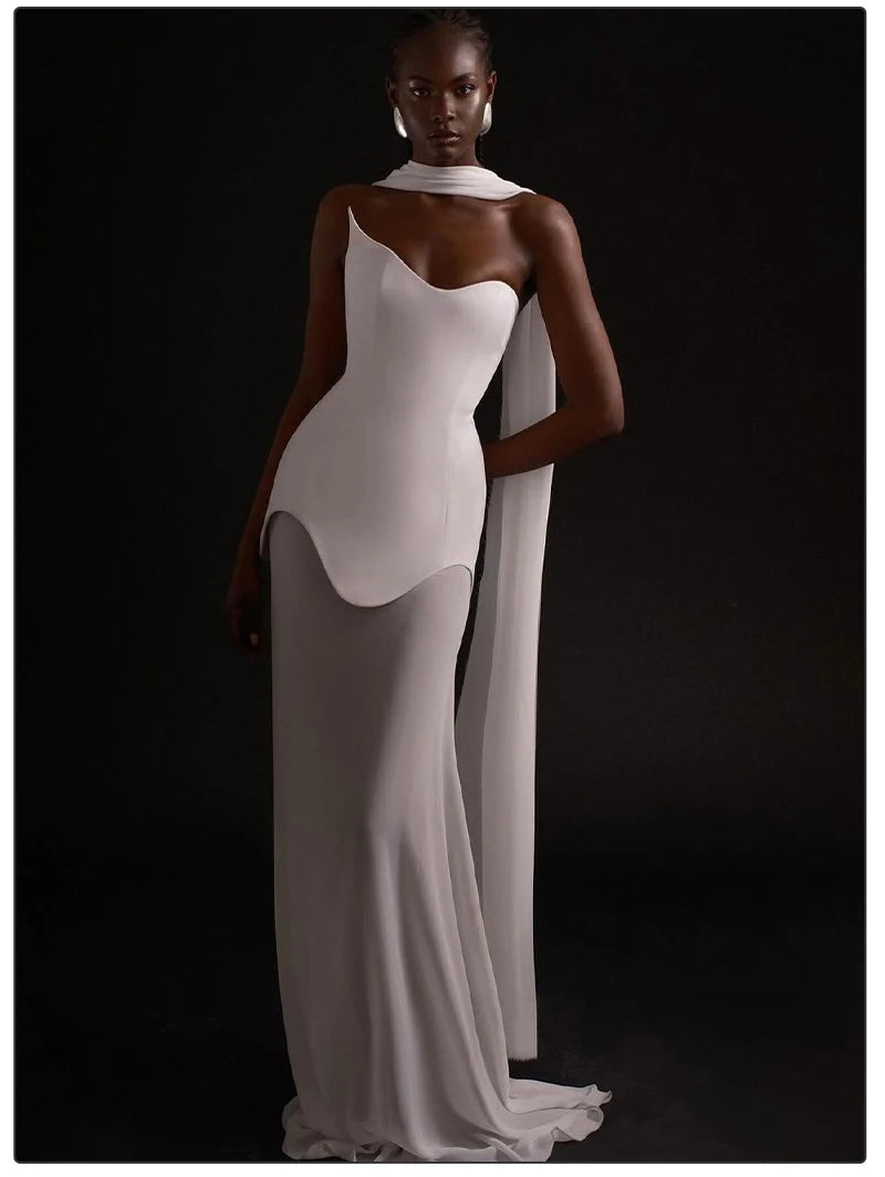 White evening gown with a high slit on a black background