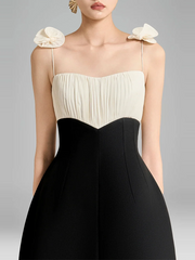 Close-up of ruched bodice and floral shoulder detail on midi dress